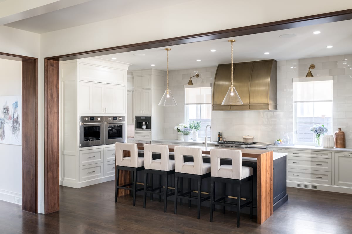 A finished luxury kitchen with custom cabinetry and warm natural light